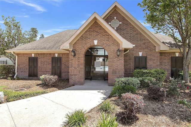 16702 Morning Shadows Way, Humble, TX 77346 - view of front of house with brick siding and a shingled roof