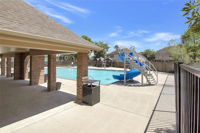 16702 Morning Shadows Way, Humble, TX 77346 - community pool featuring stairs, a fenced backyard, a water slide, and a patio area