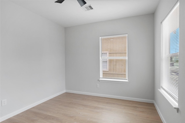 2811 Winbern St, Houston, TX 77004 - empty room featuring light wood-style flooring, a ceiling fan, and baseboards