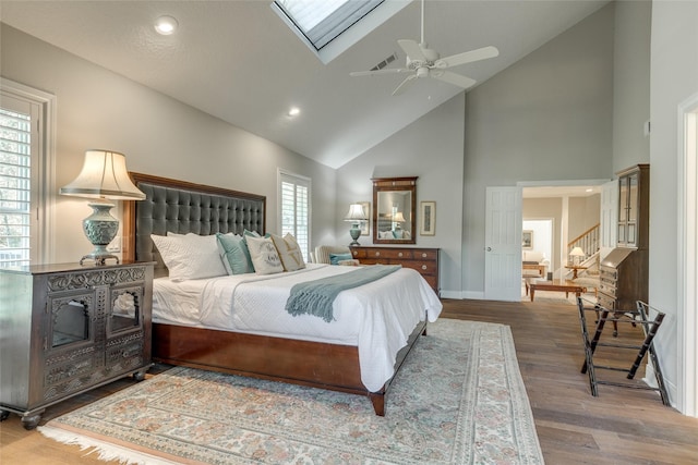 14001/14009 W Hughes Rd, Dickinson, TX 77539 - bedroom with high vaulted ceiling, wood finished floors, a ceiling fan, recessed lighting, and baseboards