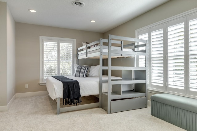 14001/14009 W Hughes Rd, Dickinson, TX 77539 - bedroom featuring multiple windows, carpet flooring, baseboards, and recessed lighting