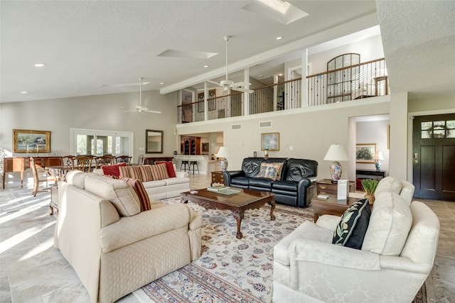 14001/14009 W Hughes Rd, Dickinson, TX 77539 - living area featuring high vaulted ceiling, ceiling fan, a textured ceiling, and recessed lighting