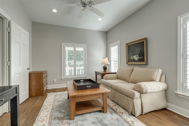 14001/14009 W Hughes Rd, Dickinson, TX 77539 - living area featuring a ceiling fan, healthy amount of natural light, light wood finished floors, baseboards, and recessed lighting