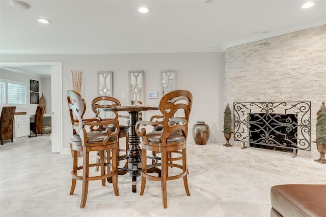 14001/14009 W Hughes Rd, Dickinson, TX 77539 - dining room with ornamental molding, recessed lighting, and a fireplace