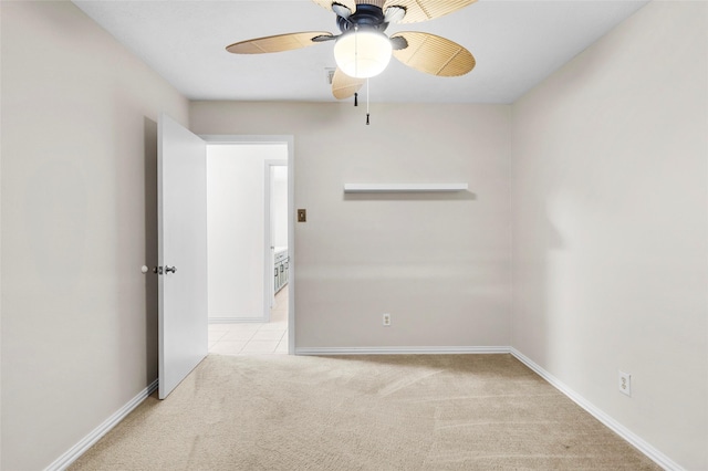 1102 Brenda Dr, Deer Park, TX 77536 - empty room with carpet flooring, a ceiling fan, and baseboards