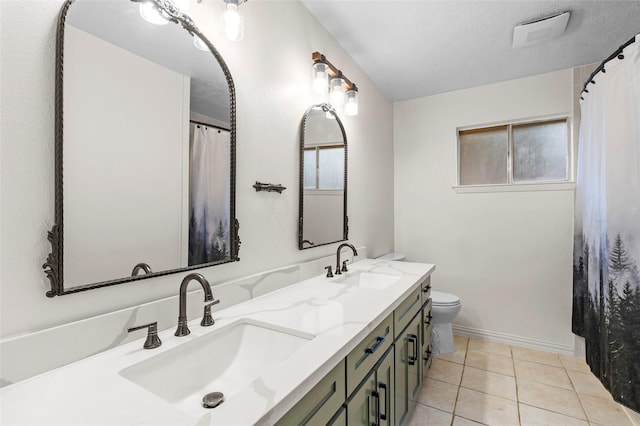 1102 Brenda Dr, Deer Park, TX 77536 - full bathroom with double vanity, toilet, tile patterned flooring, and baseboards