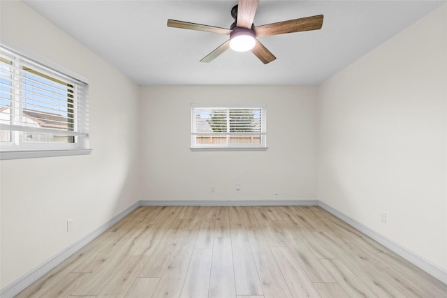 1102 Brenda Dr, Deer Park, TX 77536 - unfurnished room featuring light wood finished floors, ceiling fan, and baseboards
