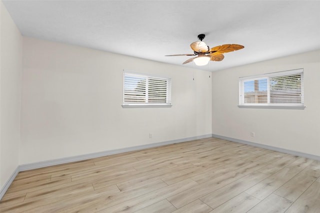 1102 Brenda Dr, Deer Park, TX 77536 - spare room featuring light wood-type flooring, baseboards, and a ceiling fan
