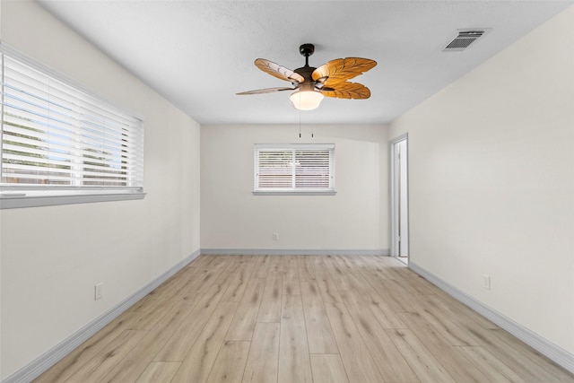 1102 Brenda Dr, Deer Park, TX 77536 - spare room with light wood-style flooring, baseboards, and ceiling fan
