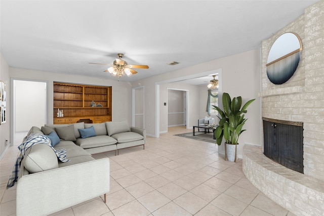 1102 Brenda Dr, Deer Park, TX 77536 - living room featuring ceiling fan, a fireplace, light tile patterned flooring, and built in shelves