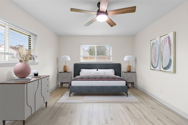 1102 Brenda Dr, Deer Park, TX 77536 - bedroom featuring light wood-type flooring, baseboards, and ceiling fan
