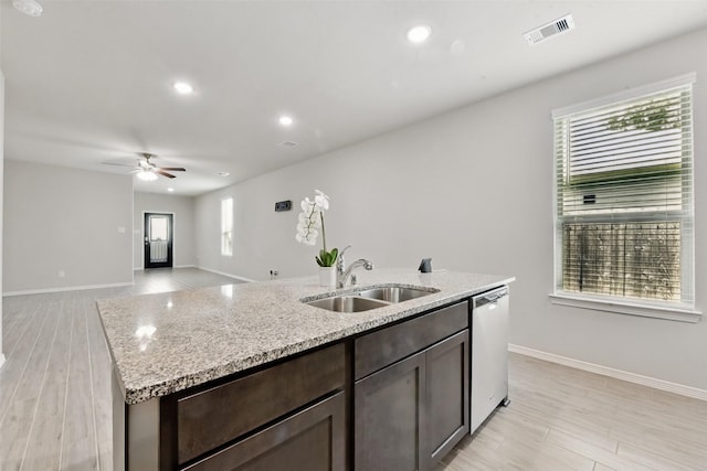 25707 Hickory Pecan Trl, Tomball, TX 77375 - kitchen with dishwasher, a sink, an island with sink, light wood finished floors, and recessed lighting