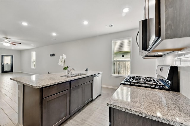 25707 Hickory Pecan Trl, Tomball, TX 77375 - kitchen with stainless steel appliances, a sink, healthy amount of natural light, ceiling fan, and recessed lighting