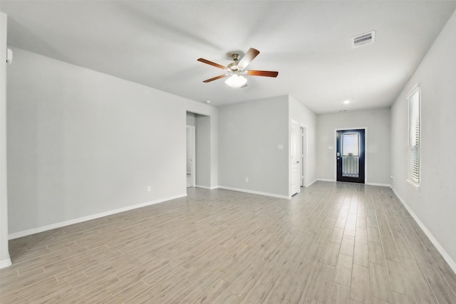 25707 Hickory Pecan Trl, Tomball, TX 77375 - empty room featuring a ceiling fan, light wood-style floors, and baseboards