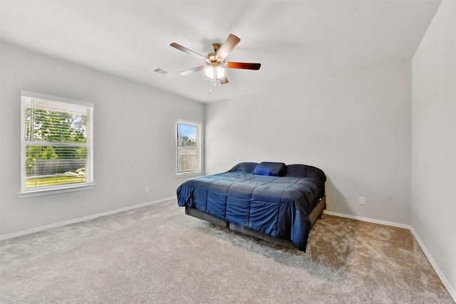 25707 Hickory Pecan Trl, Tomball, TX 77375 - bedroom featuring multiple windows, carpet flooring, and baseboards
