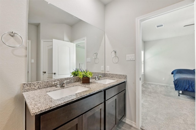 25707 Hickory Pecan Trl, Tomball, TX 77375 - ensuite bathroom featuring double vanity and baseboards