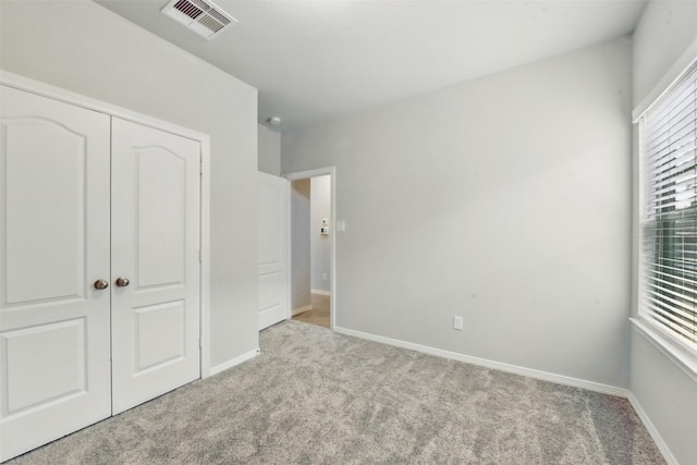 25707 Hickory Pecan Trl, Tomball, TX 77375 - unfurnished bedroom featuring carpet, a closet, and baseboards
