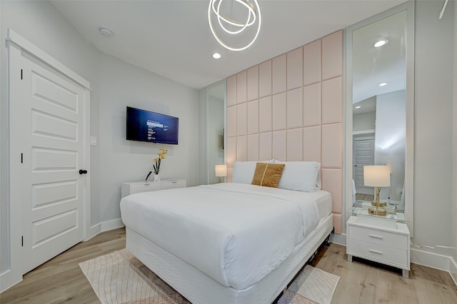 2105 Sam Wilson St Unit C, Houston, TX 77020 - bedroom featuring light wood-type flooring, baseboards, and recessed lighting