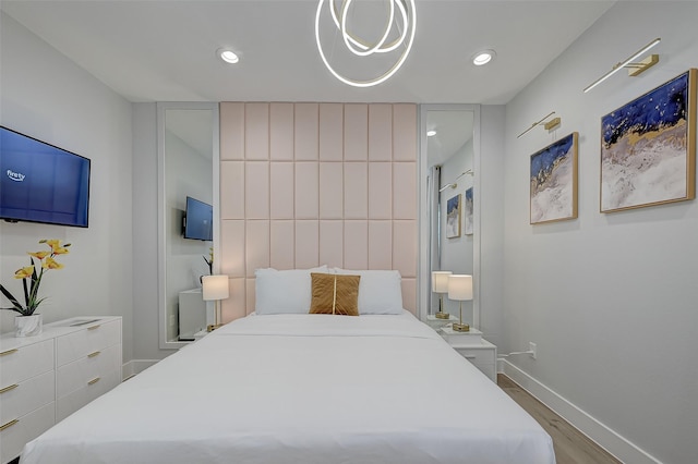 2105 Sam Wilson St Unit C, Houston, TX 77020 - bedroom with wood finished floors, baseboards, and recessed lighting