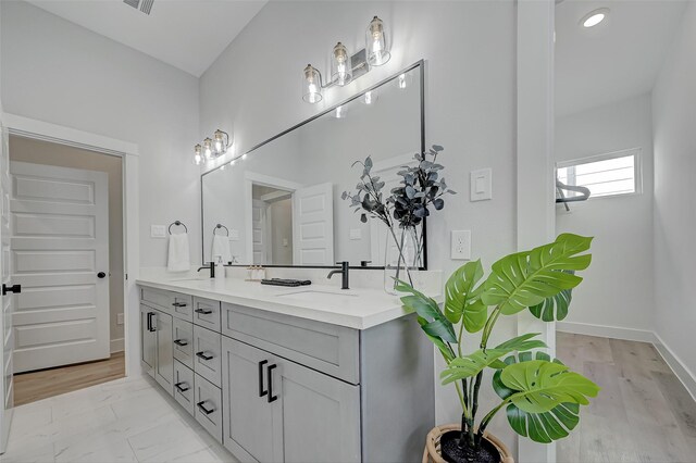 2105 Sam Wilson St Unit C, Houston, TX 77020 - bathroom featuring double vanity, baseboards, and recessed lighting