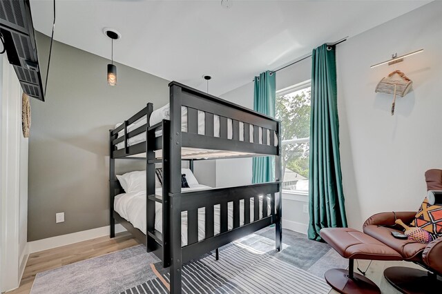 2105 Sam Wilson St Unit C, Houston, TX 77020 - bedroom featuring wood finished floors and baseboards