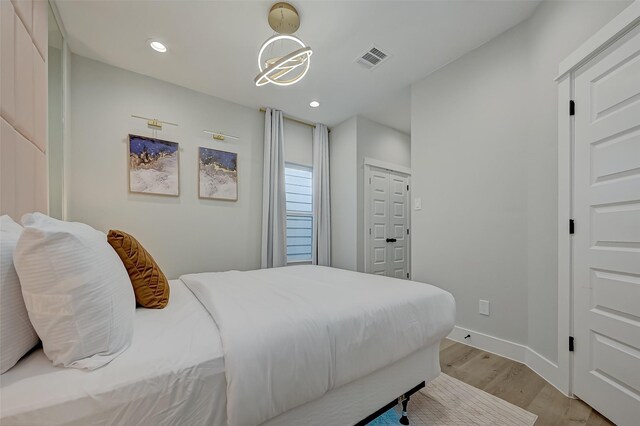 2105 Sam Wilson St Unit C, Houston, TX 77020 - bedroom featuring light wood-style flooring, recessed lighting, and baseboards