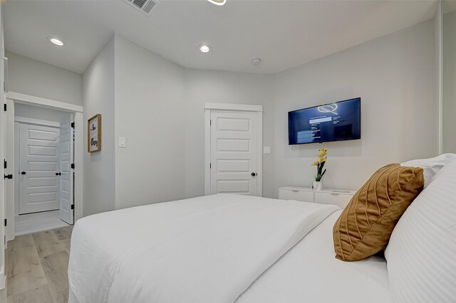 2105 Sam Wilson St Unit C, Houston, TX 77020 - bedroom featuring light wood finished floors and recessed lighting