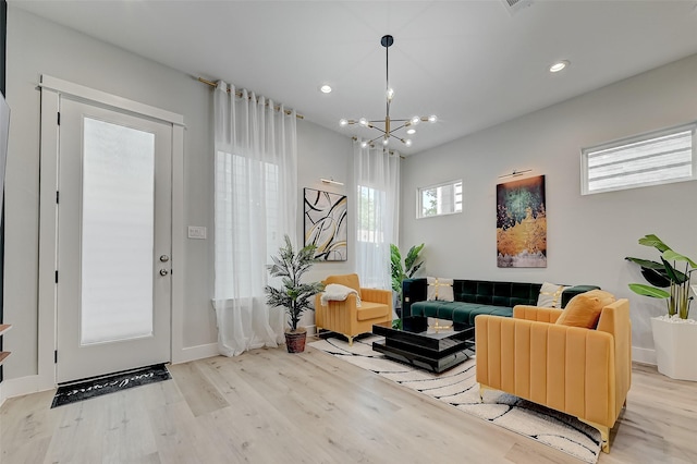 2105 Sam Wilson St Unit C, Houston, TX 77020 - living area featuring wood finished floors, a chandelier, baseboards, and recessed lighting