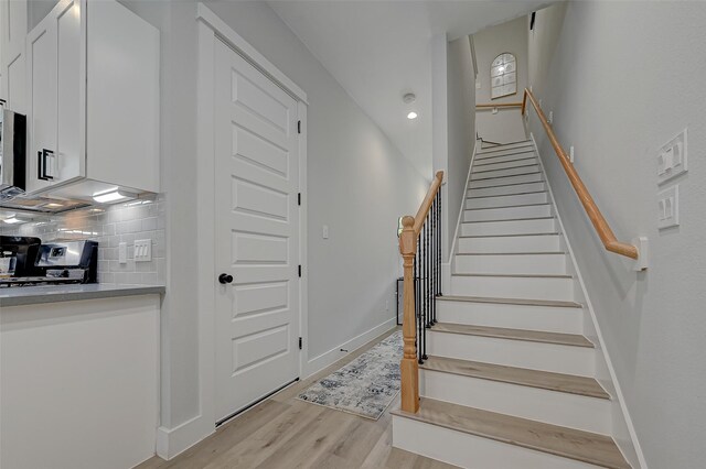 2105 Sam Wilson St Unit C, Houston, TX 77020 - stairway with wood finished floors, baseboards, and recessed lighting