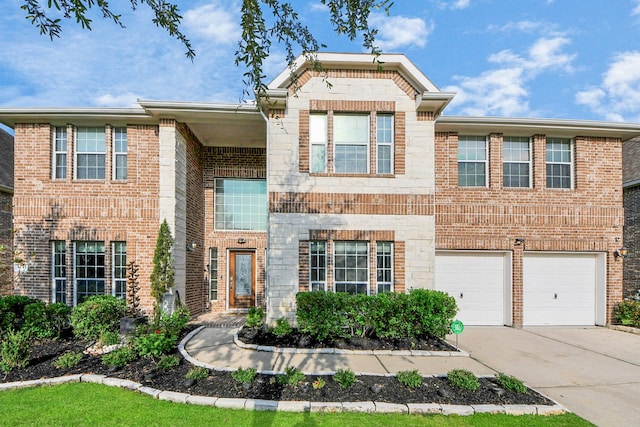 14311 Lakepointe Bend Ln, Cypress, TX 77429 - view of front of property featuring driveway, a garage, brick siding, and stone siding