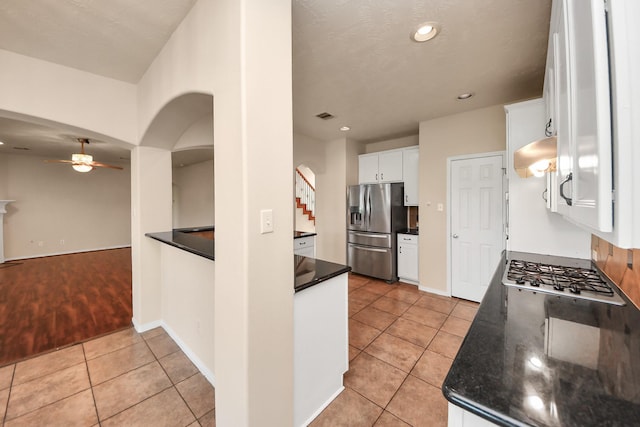 14311 Lakepointe Bend Ln, Cypress, TX 77429 - kitchen featuring appliances with stainless steel finishes, dark countertops, ceiling fan, light tile patterned floors, and recessed lighting
