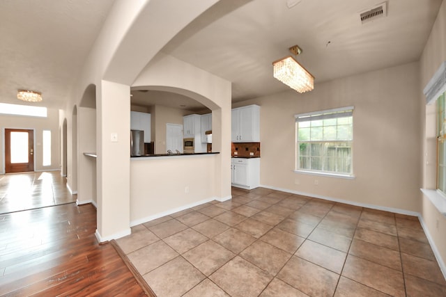 14311 Lakepointe Bend Ln, Cypress, TX 77429 - unfurnished living room with baseboards and tile patterned flooring
