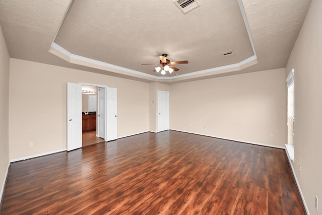 14311 Lakepointe Bend Ln, Cypress, TX 77429 - empty room with a tray ceiling, dark wood-type flooring, a ceiling fan, baseboards, and a textured ceiling