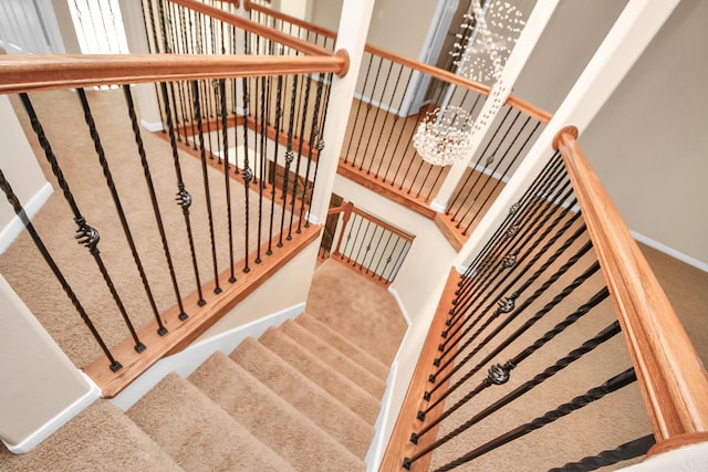 14311 Lakepointe Bend Ln, Cypress, TX 77429 - stairway with carpet flooring, a chandelier, and baseboards