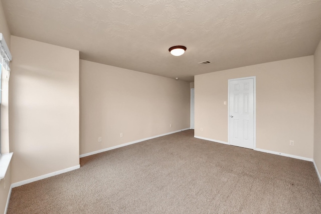 14311 Lakepointe Bend Ln, Cypress, TX 77429 - spare room with carpet floors, baseboards, and a textured ceiling
