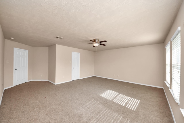 14311 Lakepointe Bend Ln, Cypress, TX 77429 - carpeted spare room with a ceiling fan, baseboards, and a textured ceiling