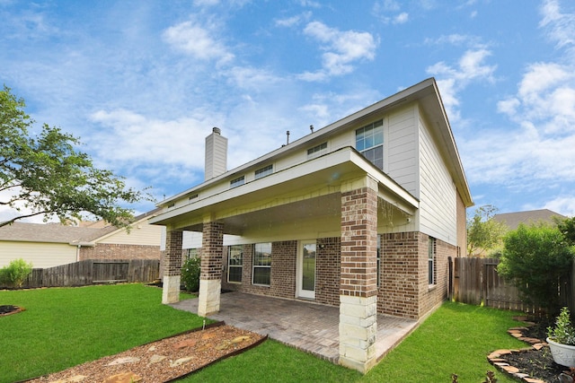 14311 Lakepointe Bend Ln, Cypress, TX 77429 - back of house with brick siding and a patio