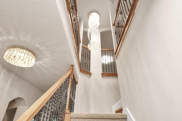 14311 Lakepointe Bend Ln, Cypress, TX 77429 - staircase featuring a chandelier