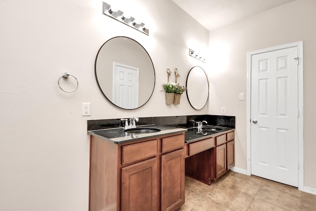 14311 Lakepointe Bend Ln, Cypress, TX 77429 - bathroom featuring double vanity, tile patterned flooring, and baseboards
