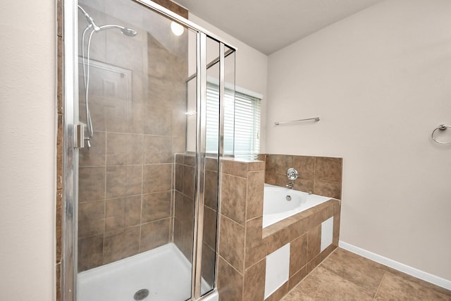 14311 Lakepointe Bend Ln, Cypress, TX 77429 - full bath featuring a stall shower, a garden tub, tile patterned flooring, and baseboards