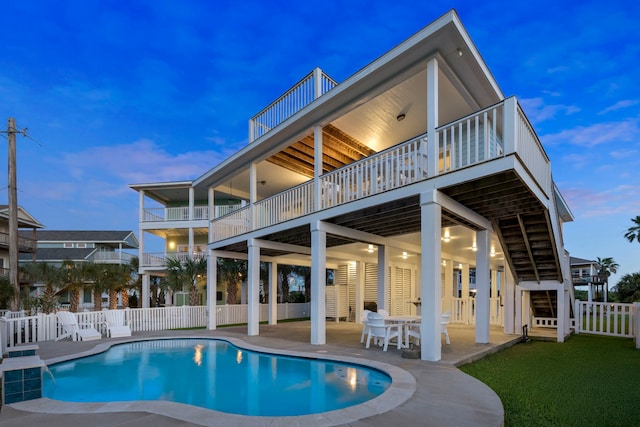 22516 Bay Point Dr, Galveston, TX 77554 - rear view of house featuring a patio area, a balcony, and a wooden deck