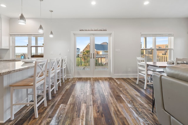 22516 Bay Point Dr, Galveston, TX 77554 - dining space with dark wood-type flooring, plenty of natural light, recessed lighting, and baseboards