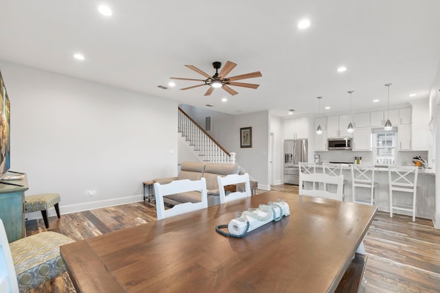 22516 Bay Point Dr, Galveston, TX 77554 - dining area with recessed lighting, ceiling fan, stairs, light wood-style floors, and baseboards