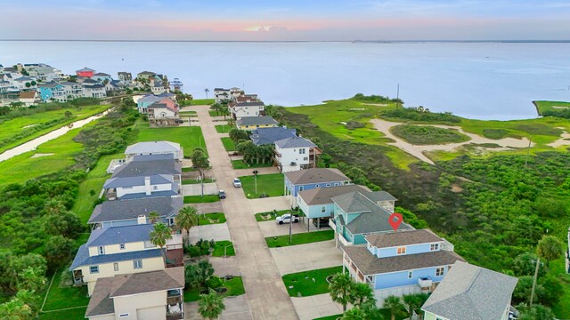 22516 Bay Point Dr, Galveston, TX 77554 - aerial view at dusk of a water view and a residential view