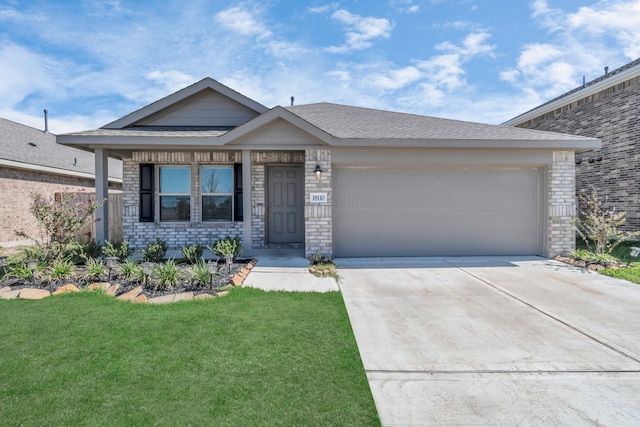 18110 Mendocino Ridge Ln, Hockley, TX 77447 - view of front of home with brick siding, driveway, a front lawn, and an attached garage