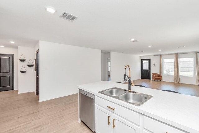 18110 Mendocino Ridge Ln, Hockley, TX 77447 - kitchen with dishwasher, a sink, recessed lighting, light countertops, and white cabinets