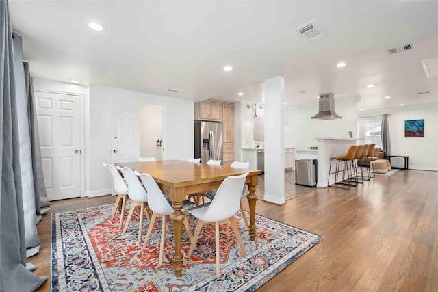 5004 Park Dr, Houston, TX 77023 - dining space with wood finished floors and recessed lighting