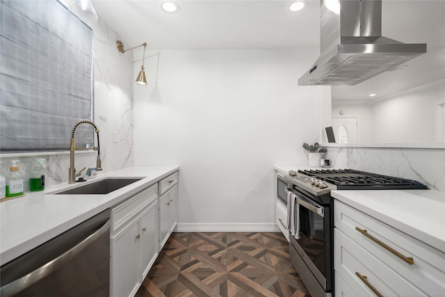 5004 Park Dr, Houston, TX 77023 - kitchen with stainless steel appliances, extractor fan, recessed lighting, decorative backsplash, and white cabinetry