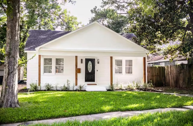 5004 Park Dr, Houston, TX 77023 - view of front of house with covered porch and a shingled roof