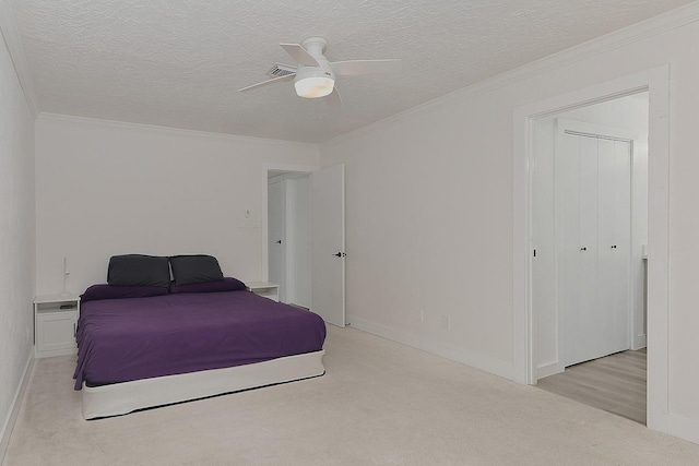 3 Meadow Beauty, The Woodlands, TX 77381 - bedroom featuring light colored carpet, ornamental molding, a textured ceiling, ceiling fan, and baseboards